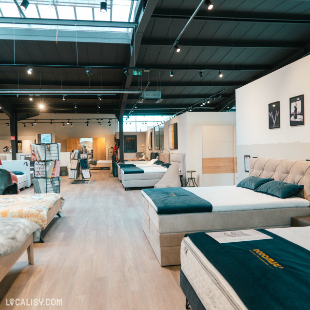 Magasin de literie Dodomax à Alleur offrant un large choix de lits et matelas exposés.